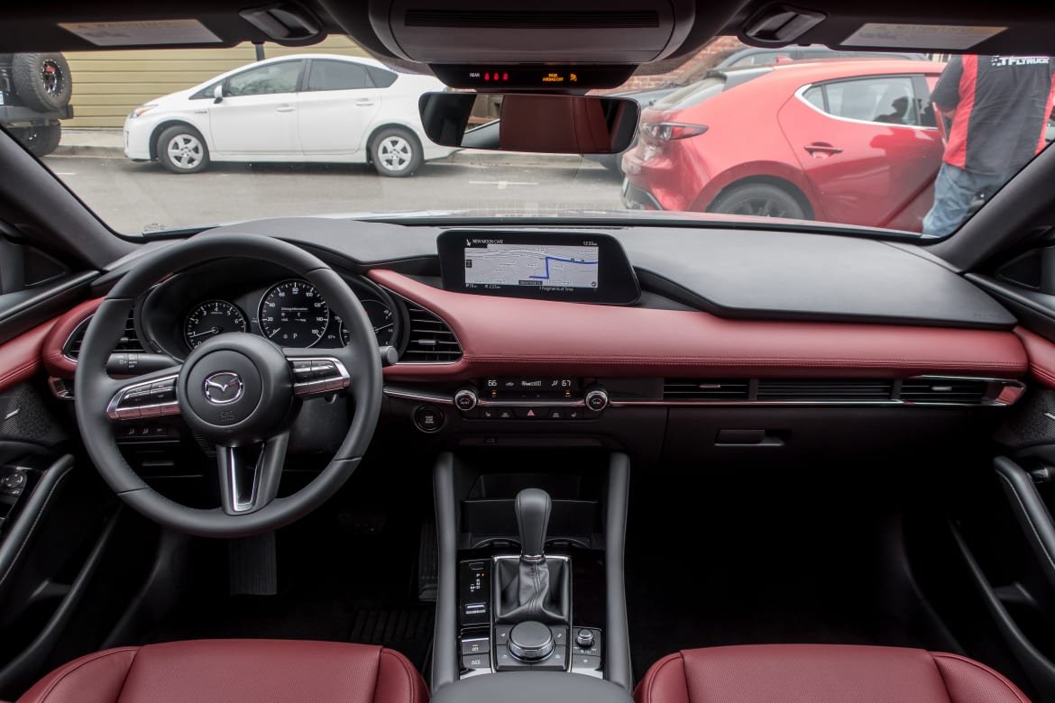 18-mazda-mazda3-2019-black--cockpit-shot--interior--red--two-ton