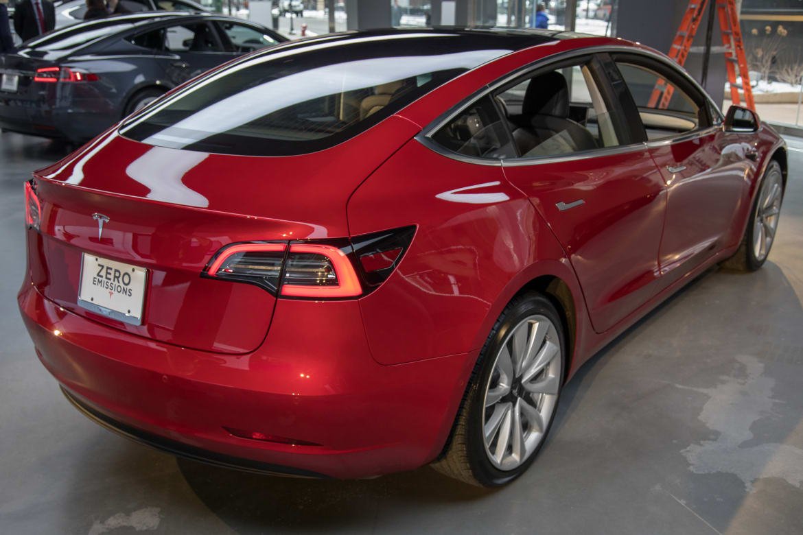 05-tesla-model-3-2017-exterior-rear angle-red.jpg
