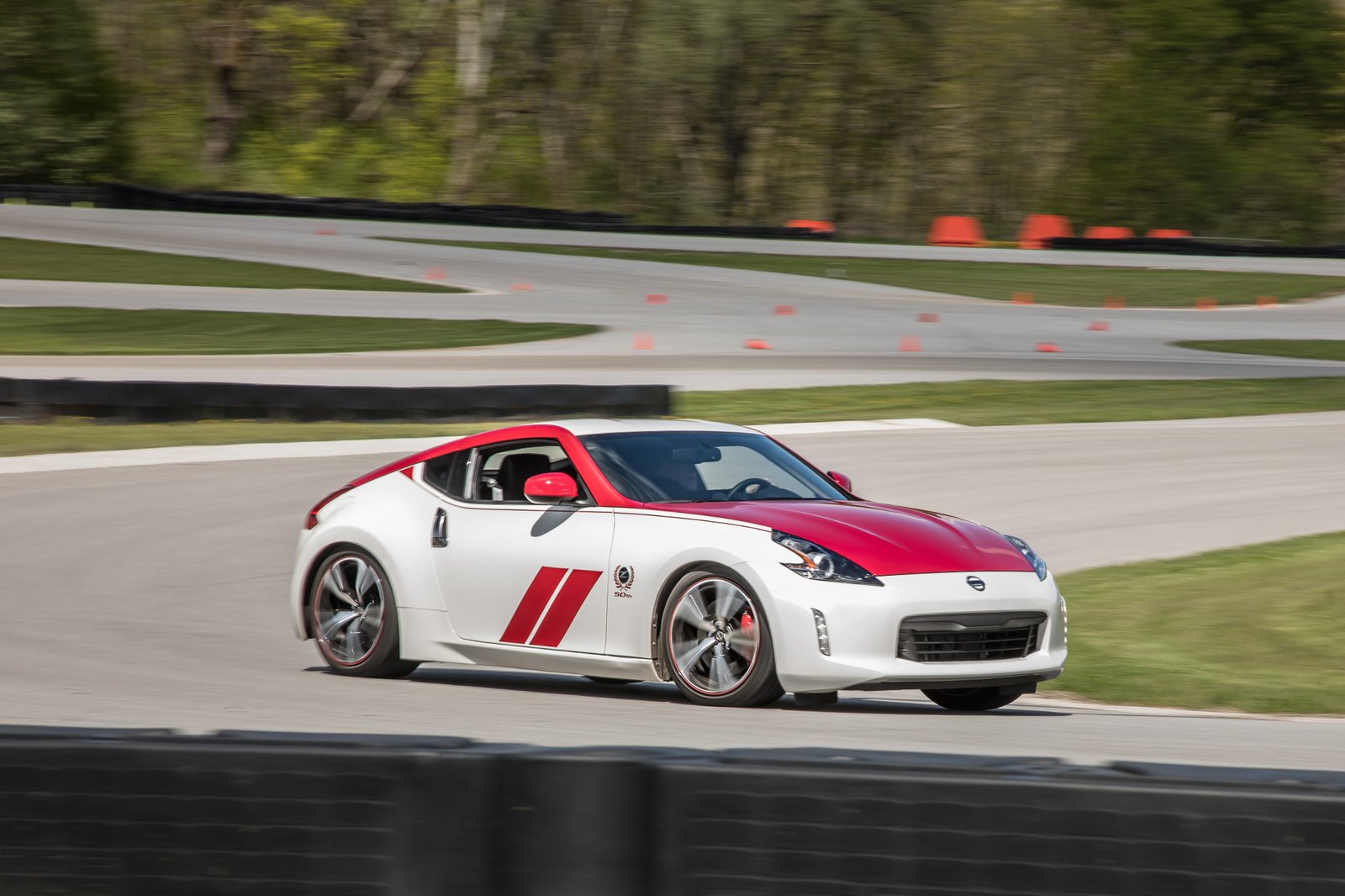 nissan-370z-50th-edition-2019-01-angle--dynamic--exterior--front--red--track--white.jpg