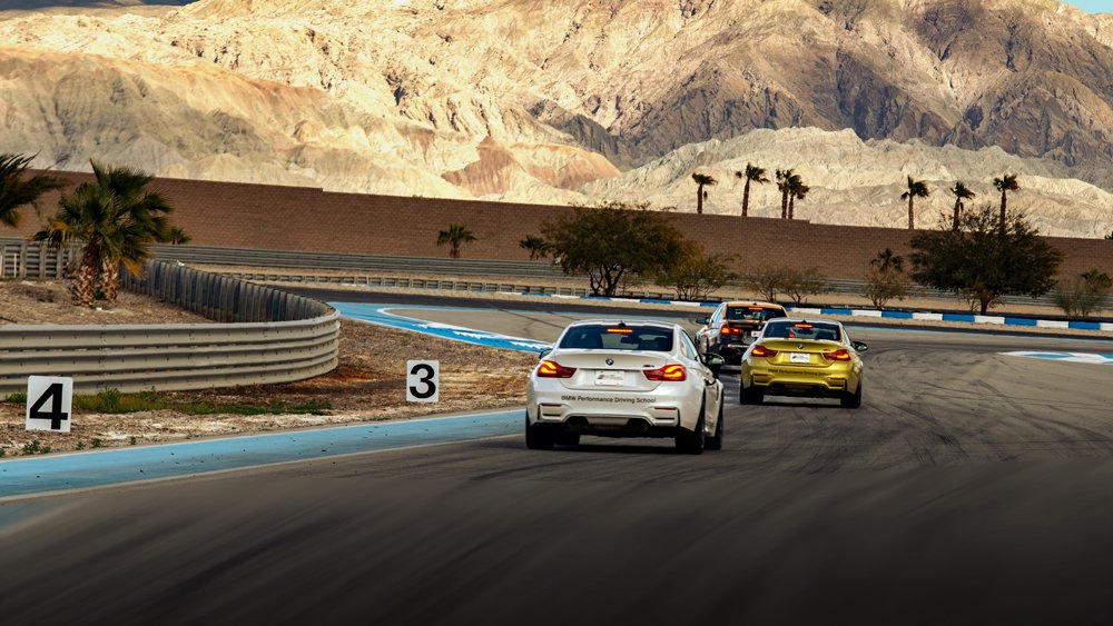 Cars on the track at BMW's Performance Center West.