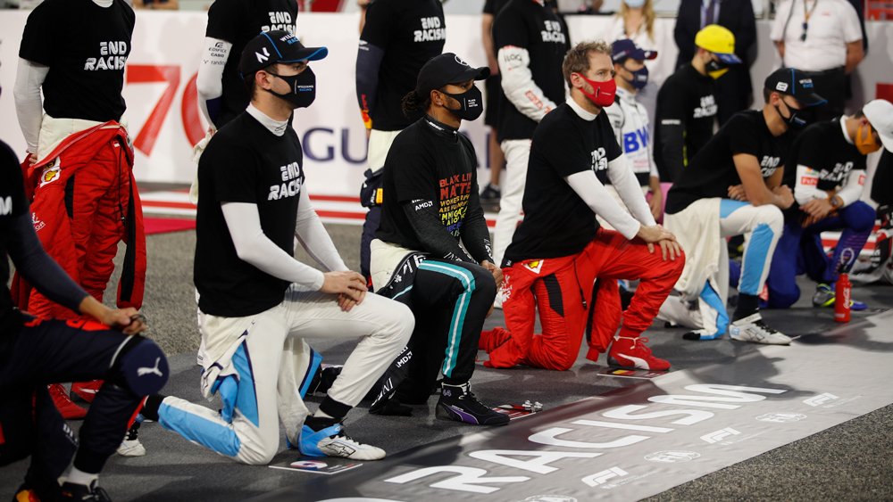 Mercedes driver Lewis Hamilton, Ferrari's driver Sebastian Vettel and other racers take a knee in support of the Black Lives Matter campaign and End Racism Recognition event just prior to the Bahrain Grand Prix.