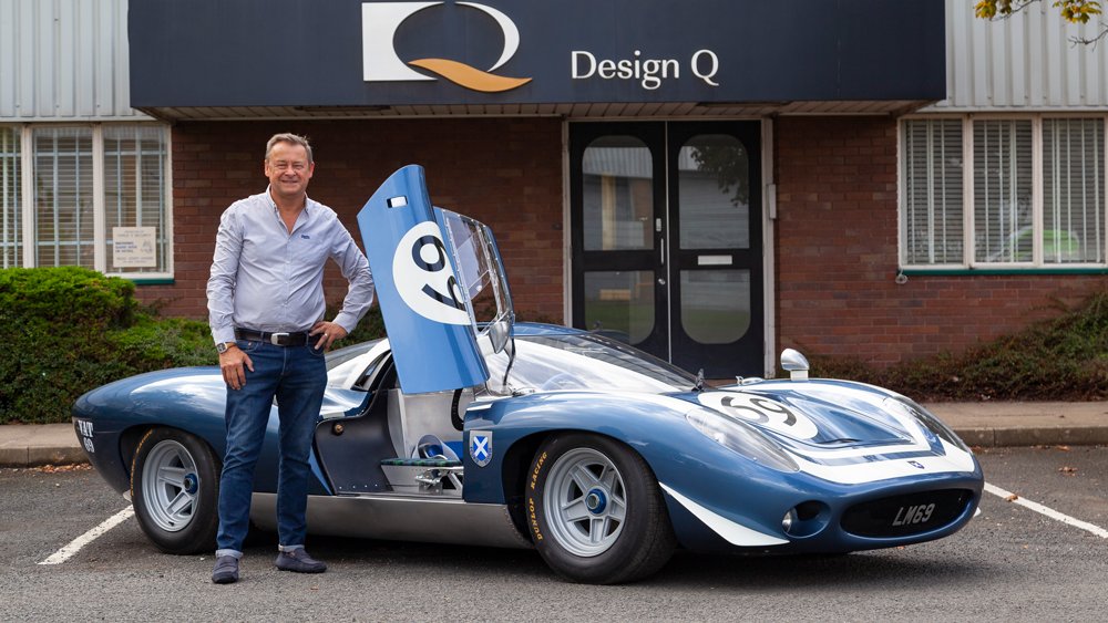 Howard Guy, CEO of Design Q, stands by the Ecurie Ecosse LM69.