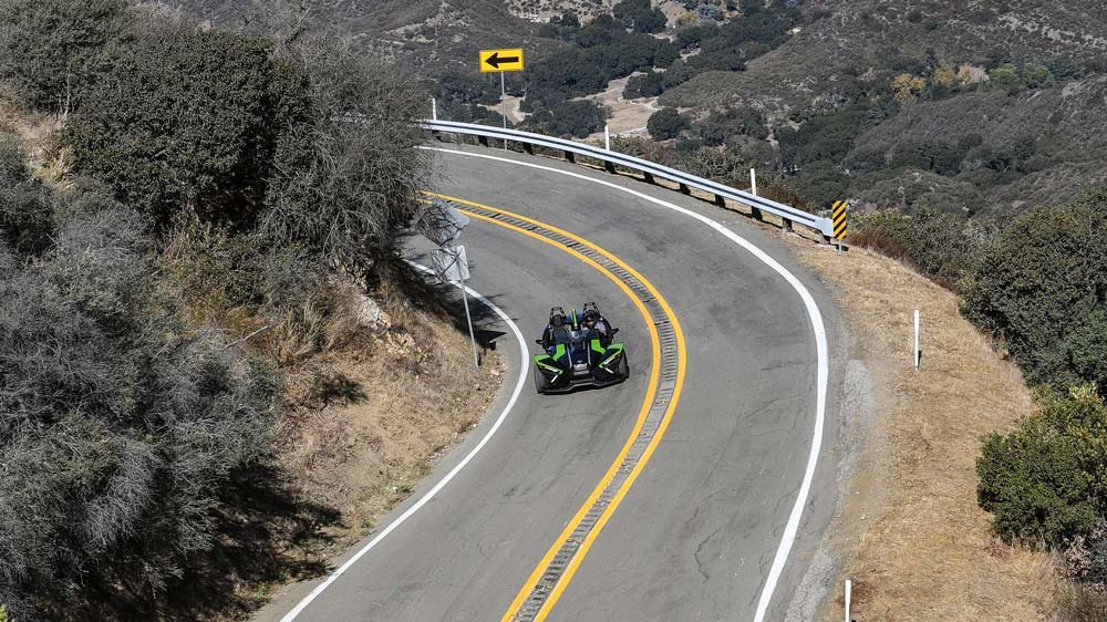 The 2021 Polaris Slingshot SL on a canyon road above Malibu.