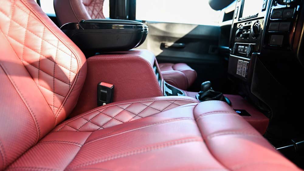 Heated Recaro seats sit inside Osprey's replica of the Land Rover seen in the James Bond film Spectre.