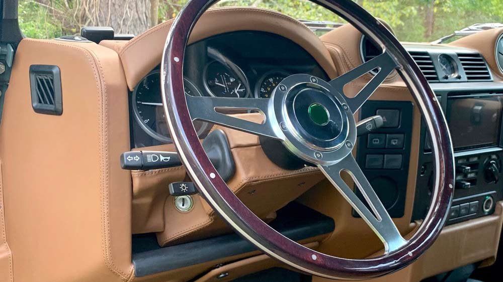 The interior of a restomod Land Rover Defender 110 from Osprey Custom Cars.