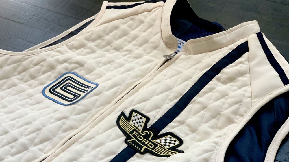 The Ford v. Ferrari Carroll Shelby Crew Vest, in white with blue stripes, from Original Venice Crew Apparel.