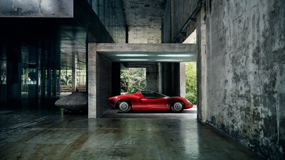 In Shenzhen, China, example of Alfa Romeo’s seductive 33 Stradale from the 1960s sits in front of an art studio and exhibition complex designed by O-Office Architects.