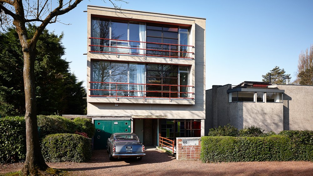 A Ferrari 250 GTE fronts a residence in Brussels designed by Belgian modernist architect Louis Herman De Koninck and built in 1924.