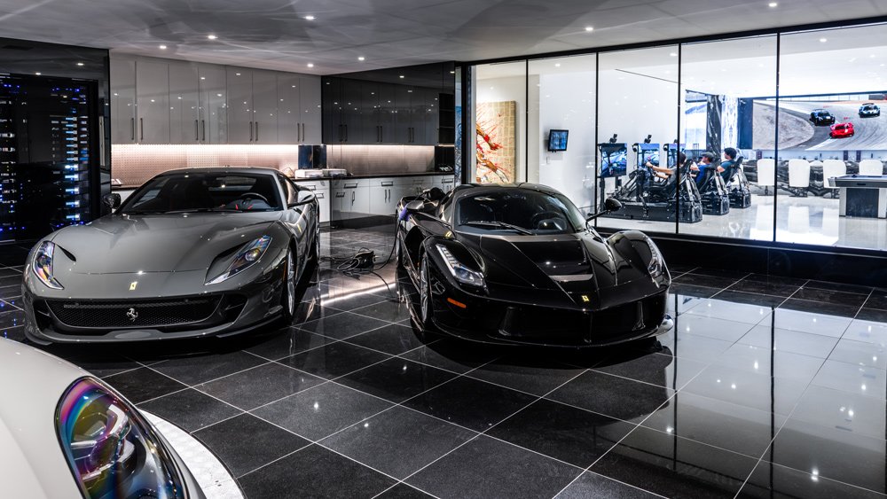 A look inside a Beverly Hills residence with three race simulators from CXC Simulations installed next to the owner's car collection.