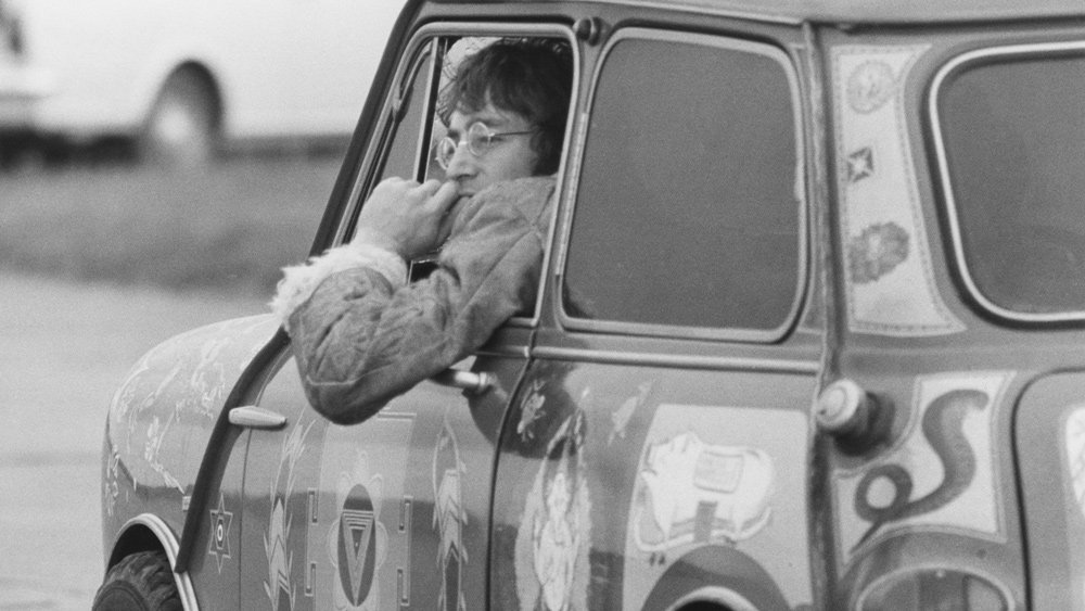 John Lennon seen in his bespoke Mini Cooper, circa the 1960s.