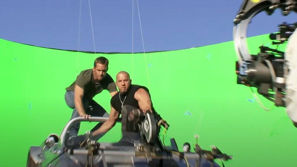 Vin Diesel and Paul Walker film the scene against a green screen