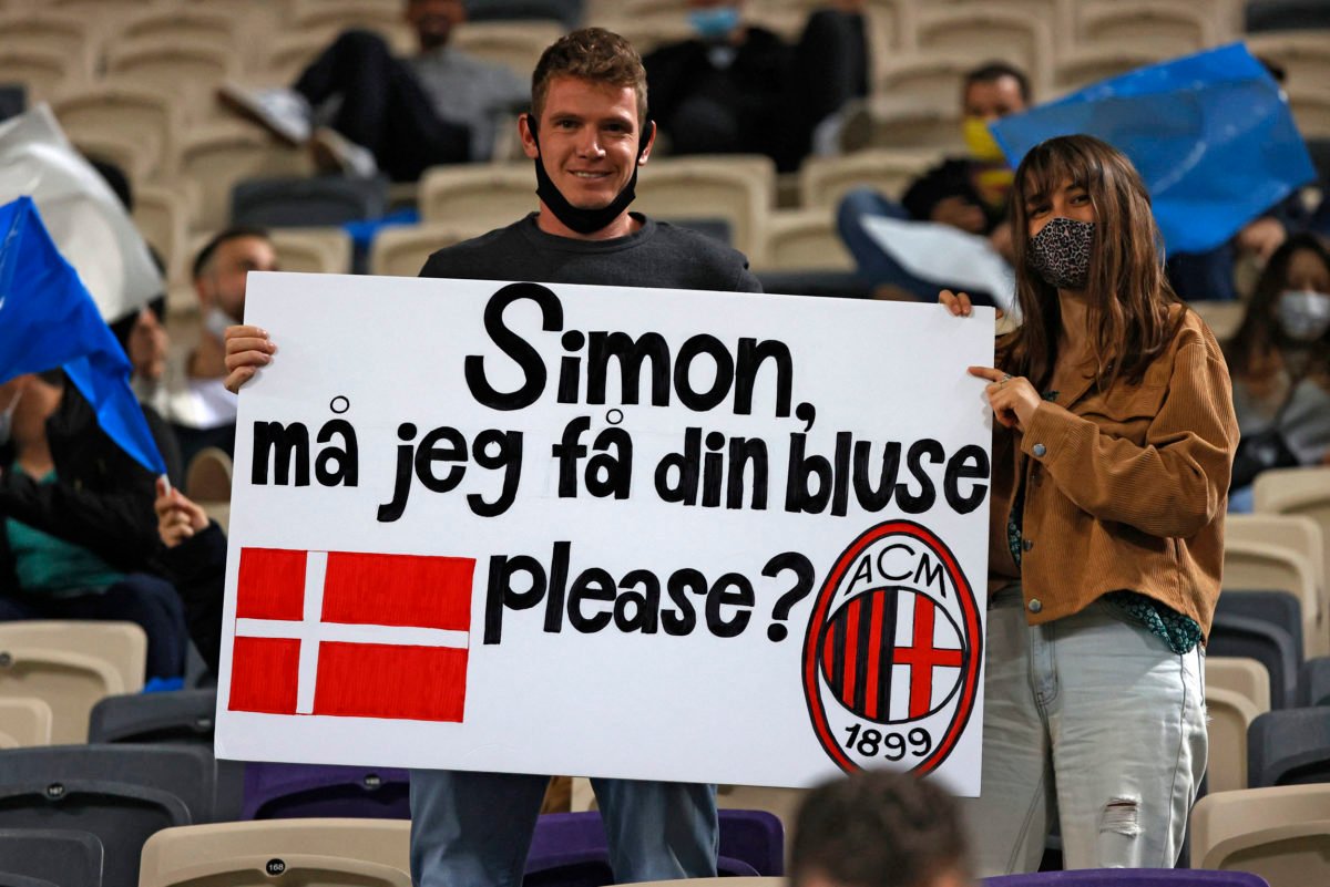 A fan asks for the shirt of Denmark's defender Simon Kjaer ahead of the 2022 FIFA World Cup qualifier group F football match between Israel and Denmark at Bloomfield stadium in the Israeli Mediterranean coastal city of Tel Aviv on March 25, 2021. (Photo by JACK GUEZ / AFP)