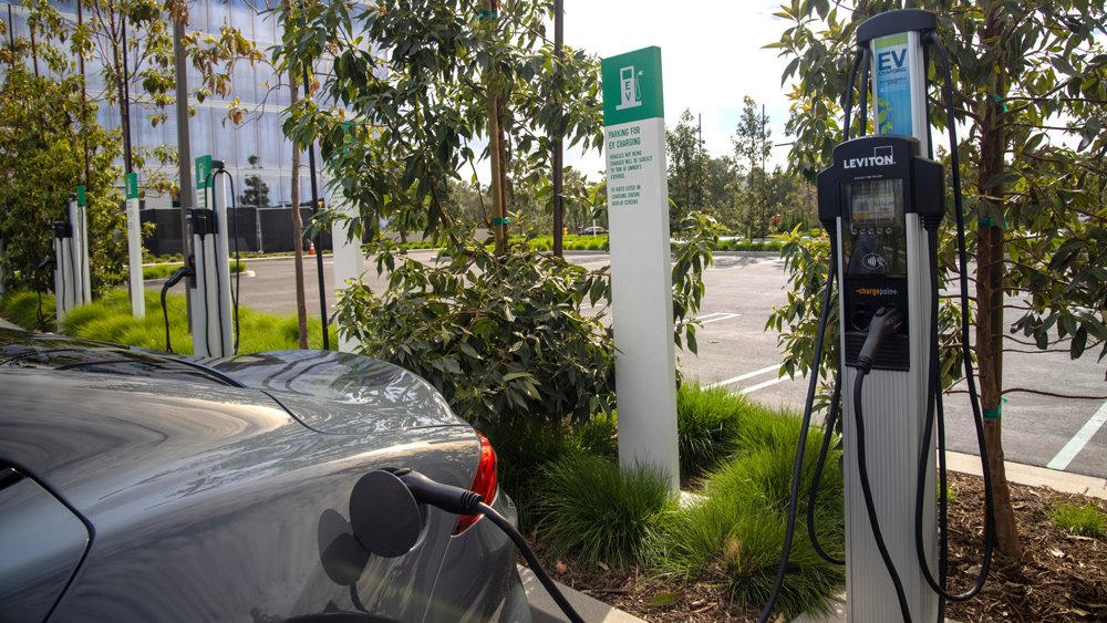 The Karma GS-6L hybrid sedan at a charging station.