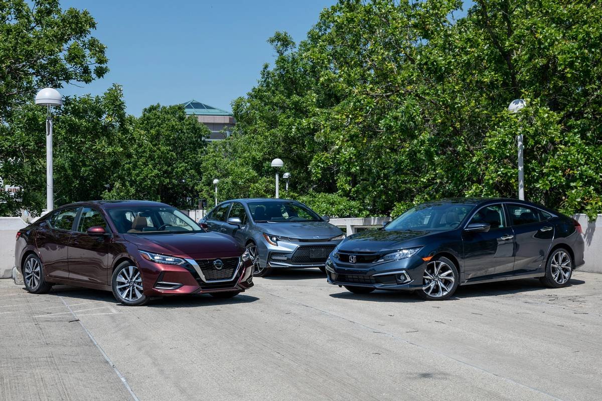 A 2020 Toyota Corolla, 2020 Nissan Sentra and 2020 Honda Civic parked in a row