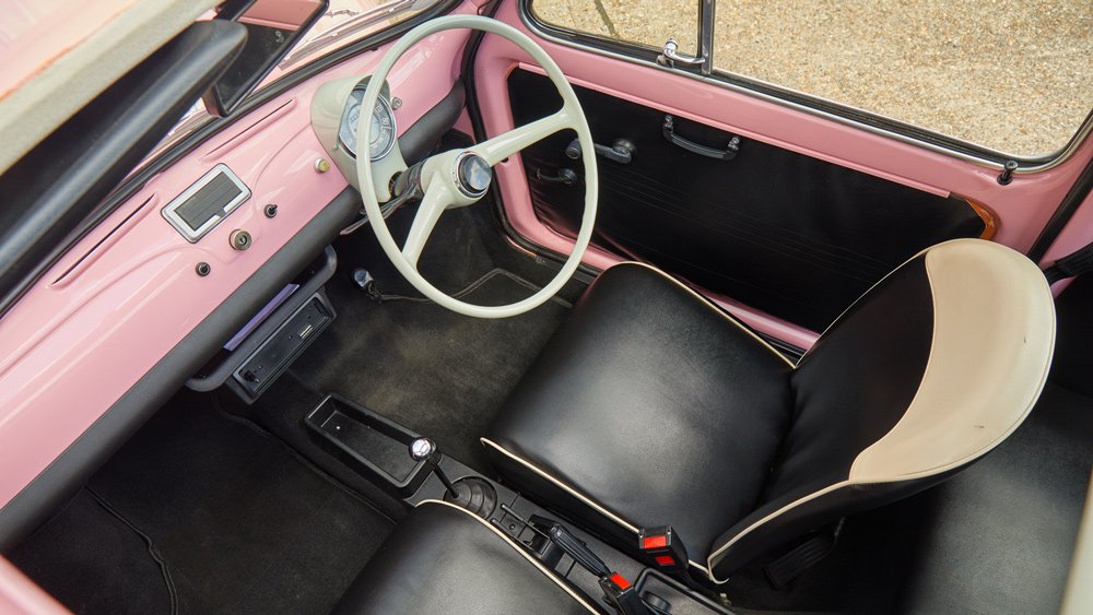 The interior of an immaculately restored 1974 Fiat Cinquecento.