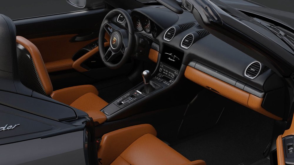 The interior of the Porsche 718 Spyder 000 package dressed in Ascot Brown.