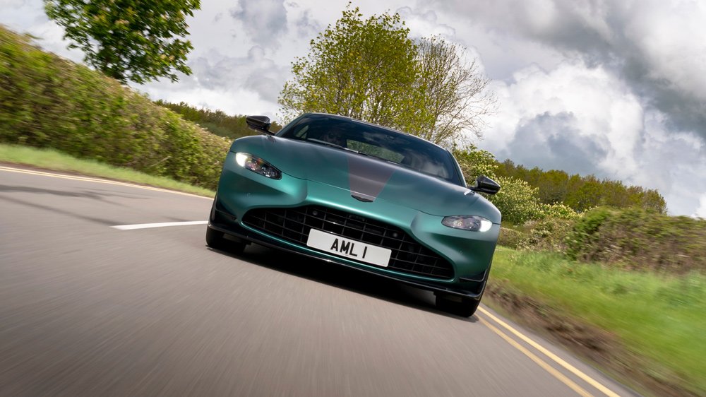 The Aston Martin Vantage F1 Edition cruising through the English countryside.