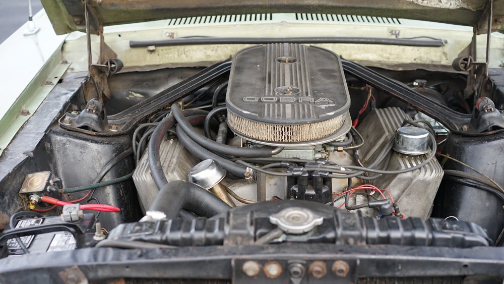 The engine inside an unrestored 1967 Shelby GT500.