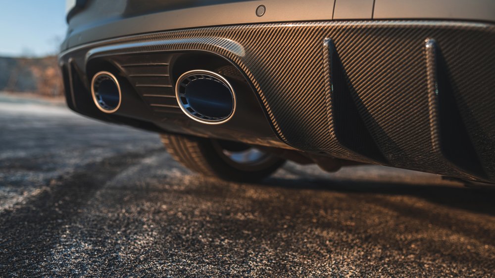 A detail of the oval exhaust tips on the 2022 Porsche Cayenne Turbo GT.
