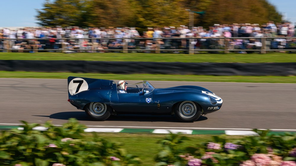 Racer Jackie Stewart drives during the 1959 TT Celebration at the 2019 Goodwood Revival.