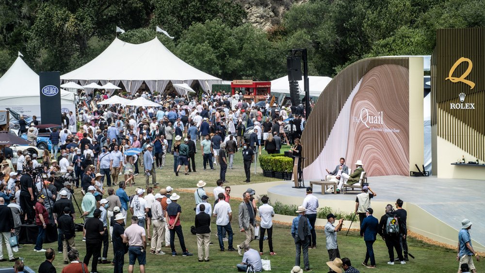 Jenson Button and Philip Kadoorie chat on stage at the Quail, a Motorsports Gathering in 2021.