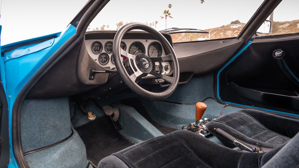 The interior of a 1975 Lancia Stratos HF Stradale rally car.