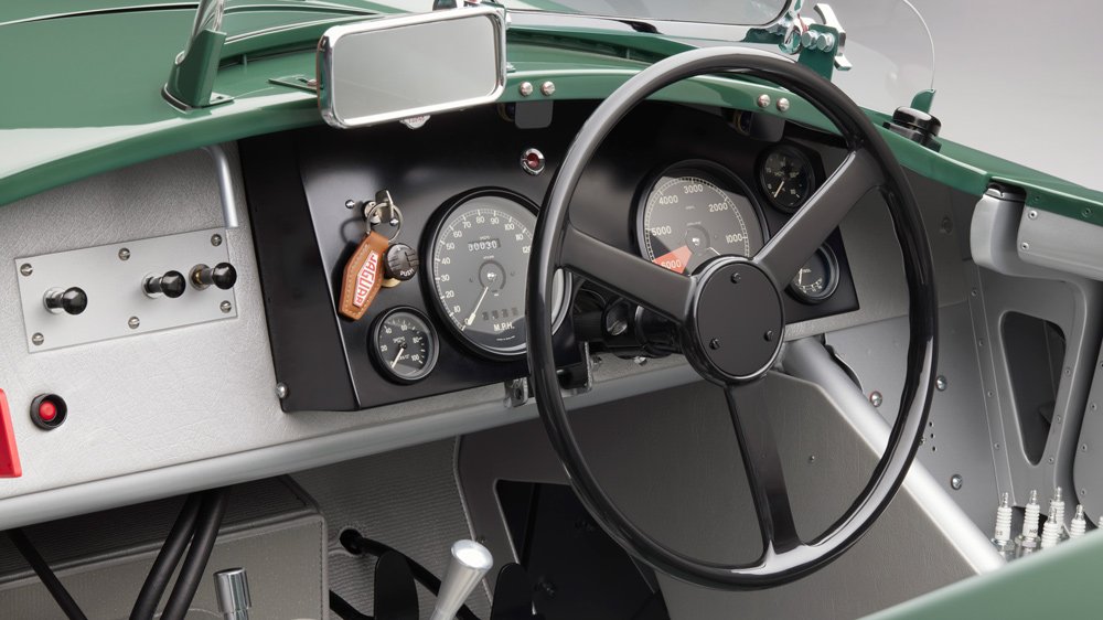 The dashboard and steering wheel inside a Jaguar C-type Continuation.
