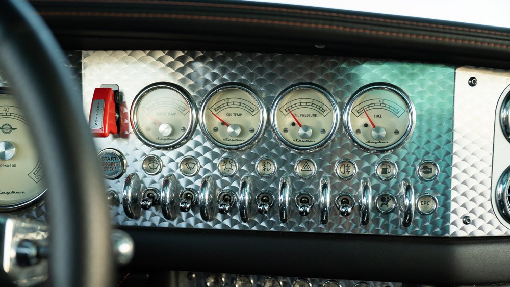 The aluminum dash of a 2009 Spyker C8 Laviolette.