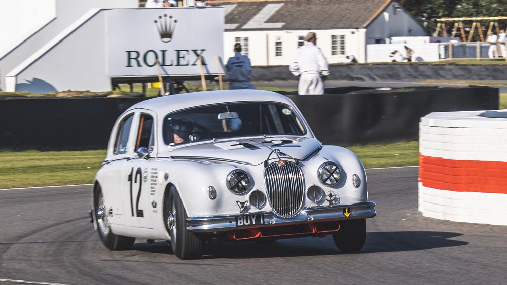 A Jaguar MK II races at the 2021 Goodwood Revival.