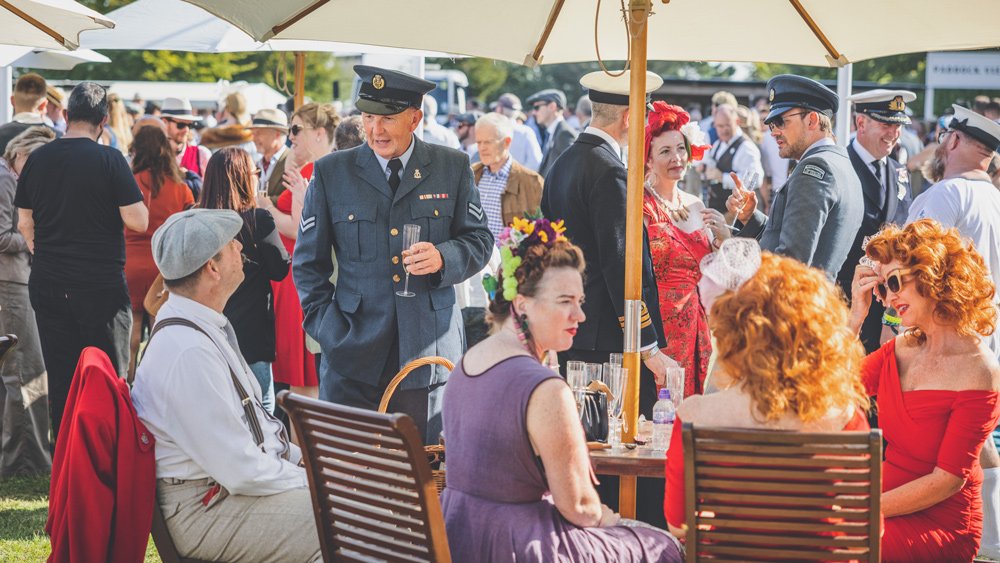 Attendees of the 2021 Goodwood Revival in period-correct attire.