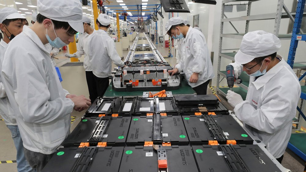 Assembling battery packs at a Sunwoda Electric Vehicle Battery factory in China.