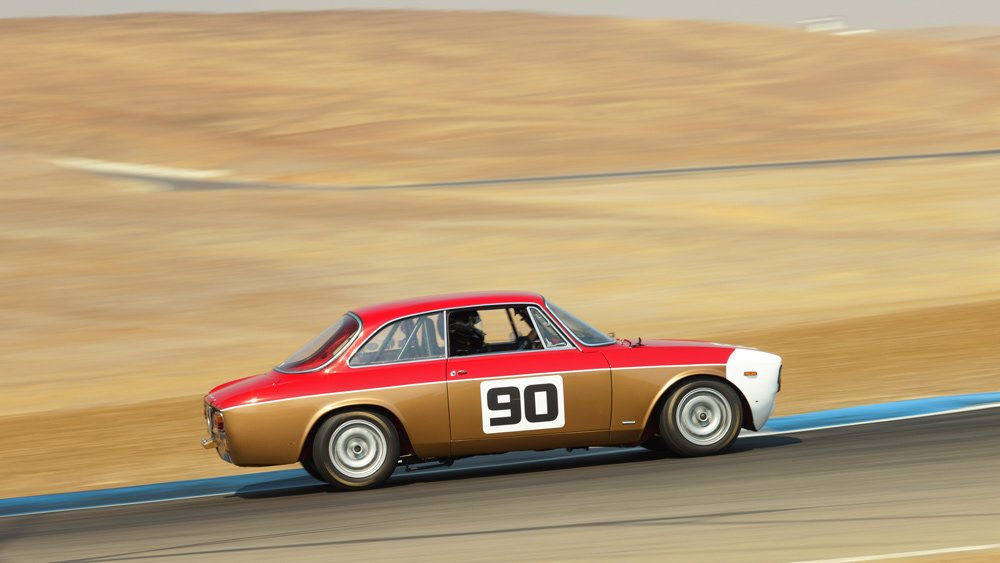 An Alfa Romeo GTA Junior on track.
