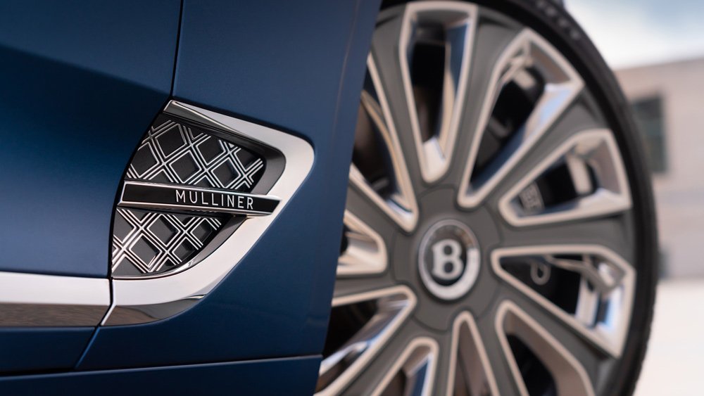 a detail of the side vents and wheels on a 2021 Bentley Continental GTC Mulliner.