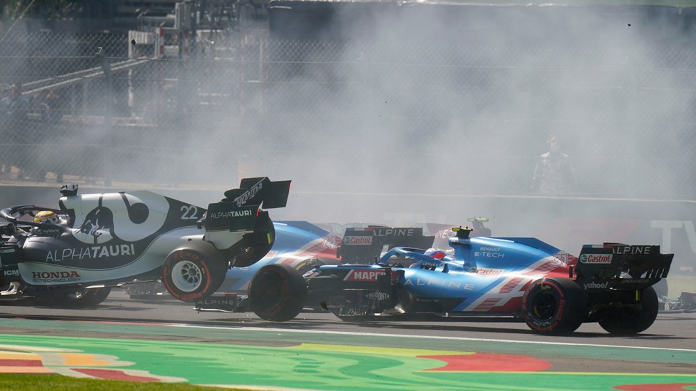 Alpha Tauri team racer Yuki Tsunoda gets knocked out of contention around the first turn at Autódromo Hermanos Rodríguez during the 2021 Mexico City Grand Prix.