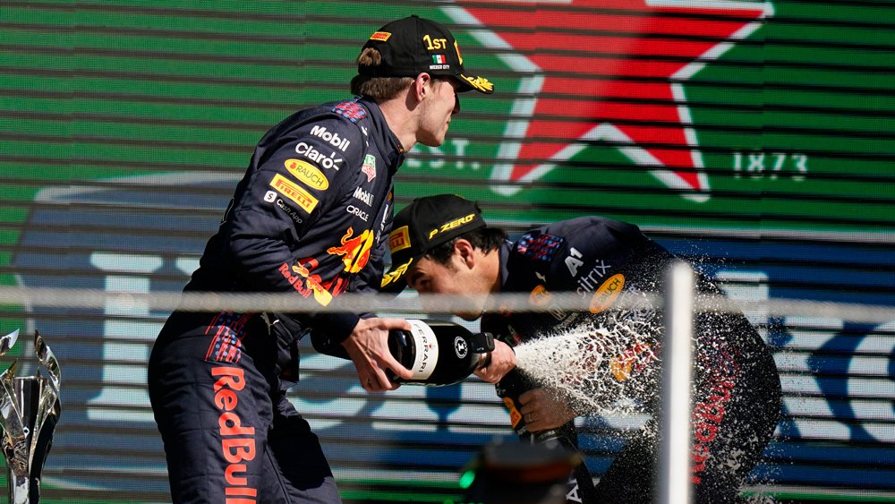 Winning driver Max Verstappen celebrates with teammate Sergio Perez after the 2021 Mexico City Grand Prix.