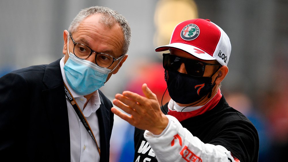 Stefano Domenicali (left) and Alfa Romeo racer Kimi Raikkonen in conversation before the 2021 Russian Grand Prix.