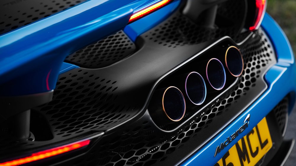 A close-up of the four titanium tailpipes on the McLaren 765LT Spider supercar.