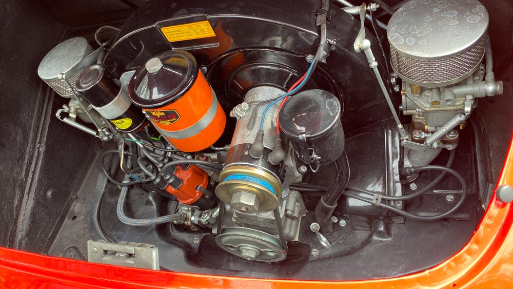The 60 hp, 1,582 cc air-cooled four-cylinder engine inside a 1955 Porsche 356 A 1600 Speedster.