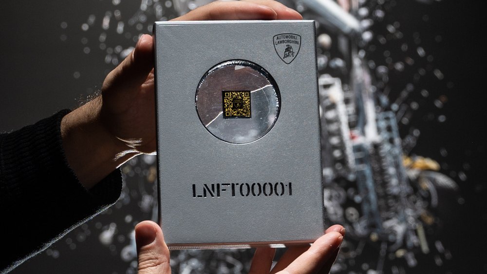 One of five Lamborghini Space Keys that comprise small pieces of carbon fiber that spent months in space and that contain a QR code to open commissioned artwork.