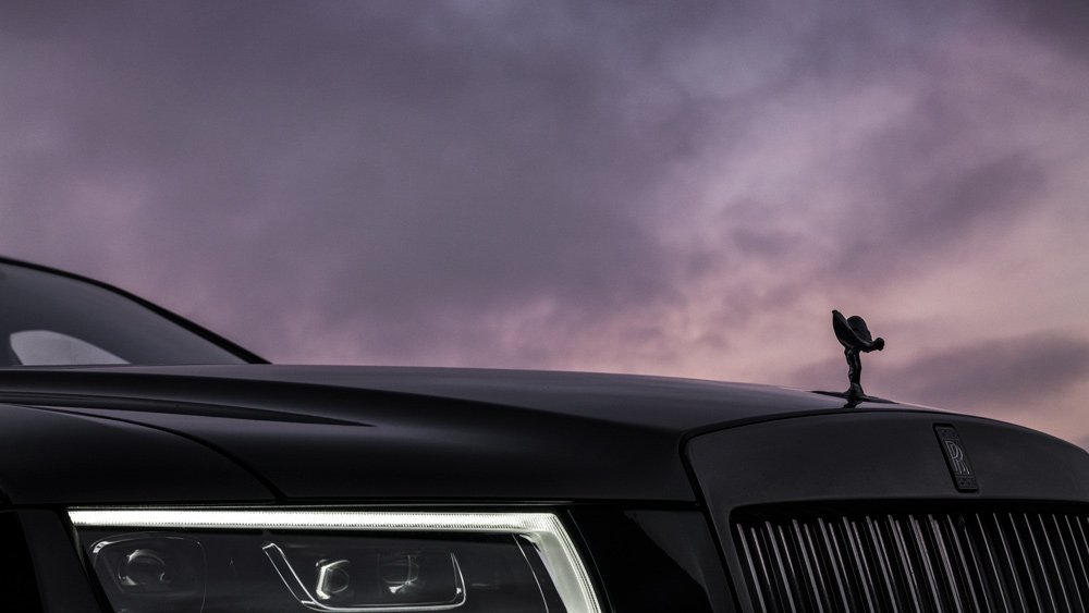 The front of the Rolls-Royce Black Badge Ghost with the Spirit of Ecstasy hood ornament.