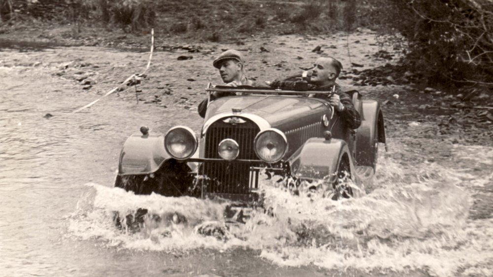 A daring duo take one of the Morgan Plus Four CX-T's predecessors through the backcountry in a bygone era.
