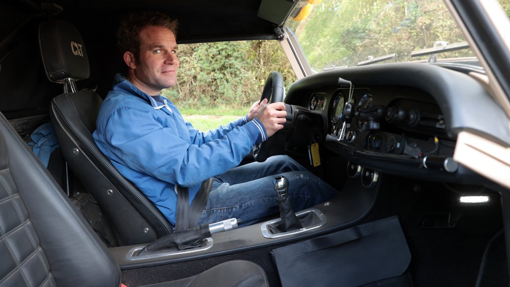 Automotive journalist Tim Pitt behind the wheel of the Morgan Plus Four CX-T.