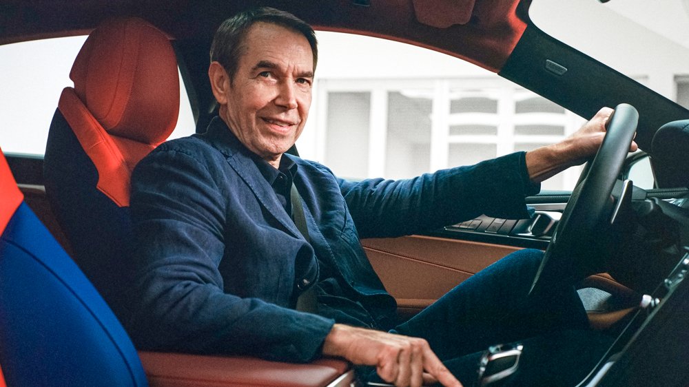 Artist Jeff Koons inside his collaboration with BMW, the 8 X Jeff Koons art car.