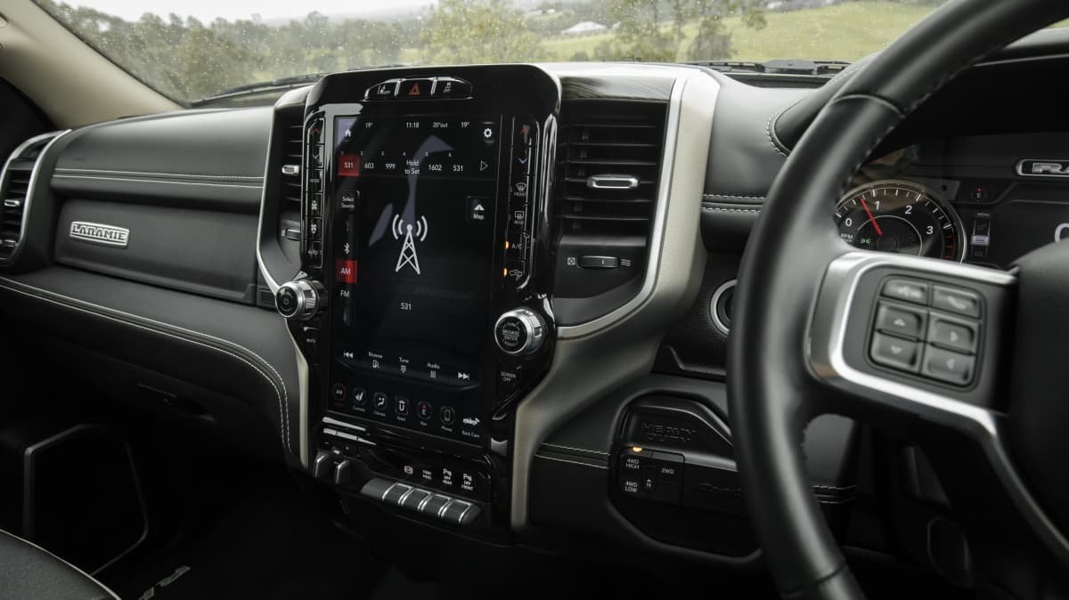 2021 Chevrolet Silverado 1500 LTZ Premium v 2022 Ram 2500 Laramie comparison-1