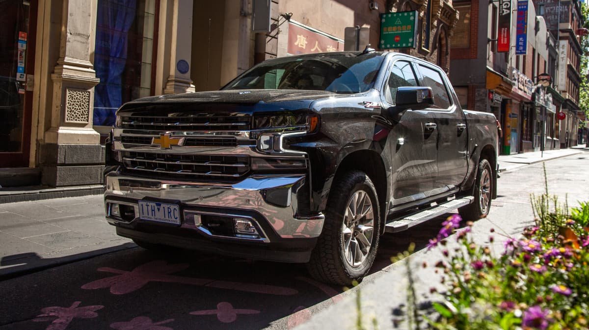 2021 Chevrolet Silverado 1500 LTZ Premium v 2022 Ram 2500 Laramie comparison-0