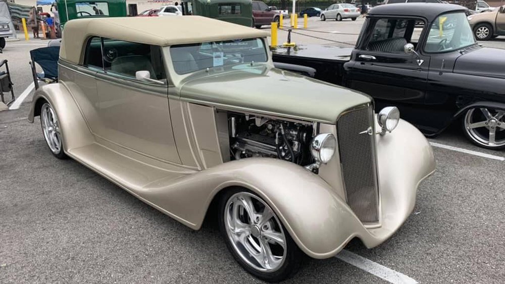 A Black Classics Car Club member's prized custom on display at a monthly gathering.