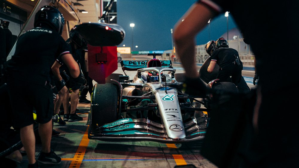 A Mercedes-AMG Petronas race car is worked on during preseason testing in Bahrain prior to the start of the 2022 Formula 1 season.