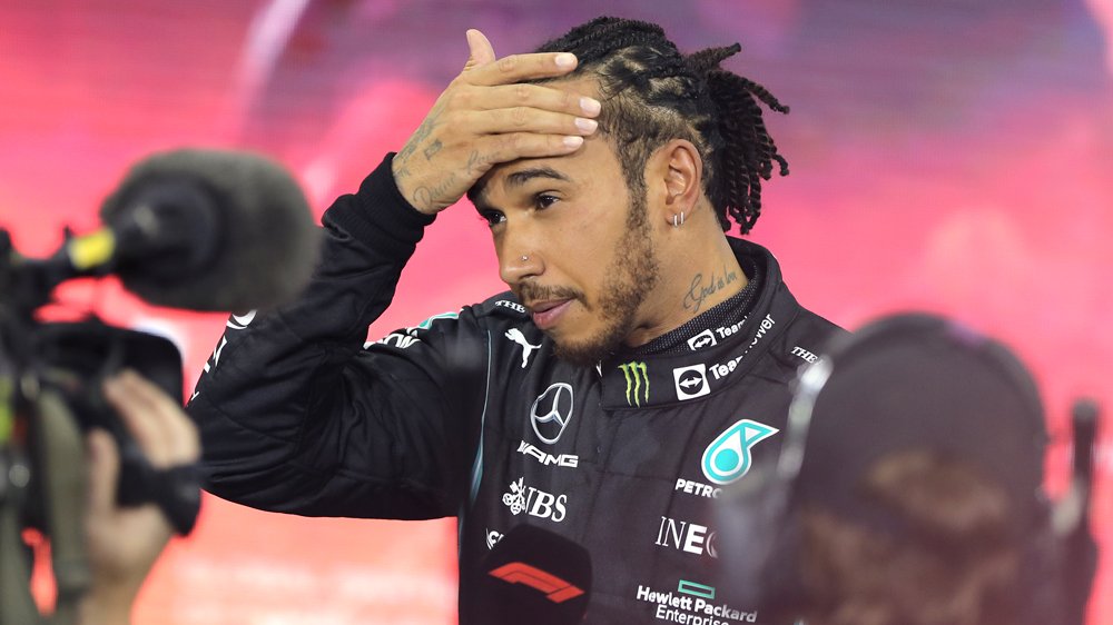 Lewis Hamilton, seven-time Formula 1 champion, responds to reporters after losing to Max Verstappen in controversial finish at the 2021 Abu Dhabi Grand Prix.