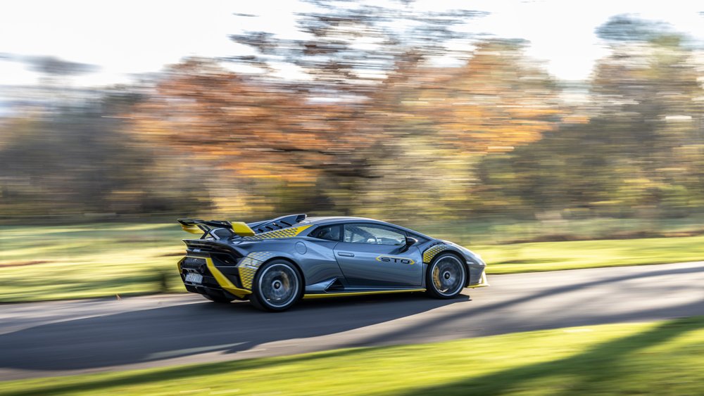 A Lamborghini Huracán STO drives through the Scottish Highlands.