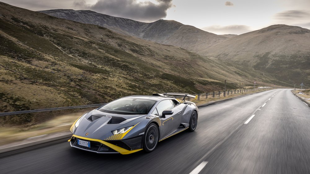 A Lamborghini Huracán STO drives through the Scottish Highlands.